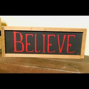 “Believe” sign